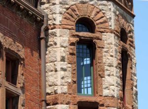 Oakes Ames Hall second-story window, framed in reddish brown Longmeadow sandstone (image credit: Buffalo Architecture and History)